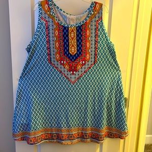 Summer dress with side pockets. 3X dress flares at the bottom.
